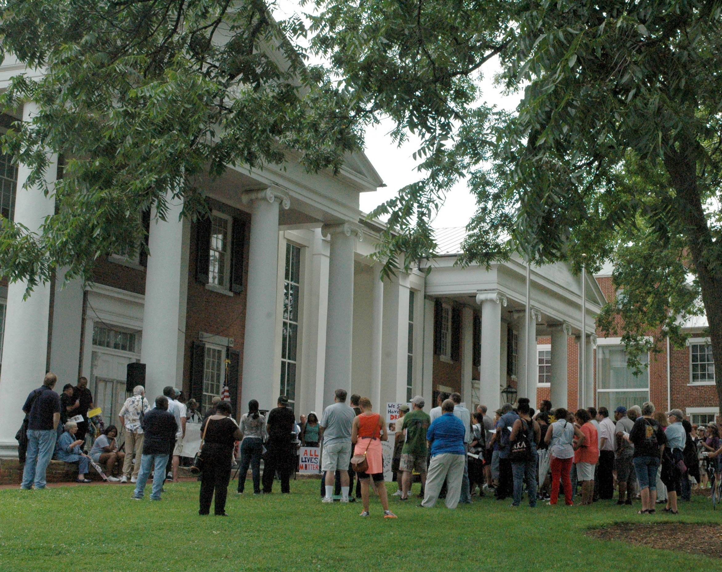 The crowd gathered in front of the Loudoun County courthouse in Leesburg on July 18 listened attentively to speakers at a rally sponsored by the Loudoun NAACP.